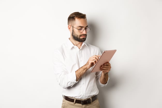 businessman-working-digital-tablet-looking-busy-standing