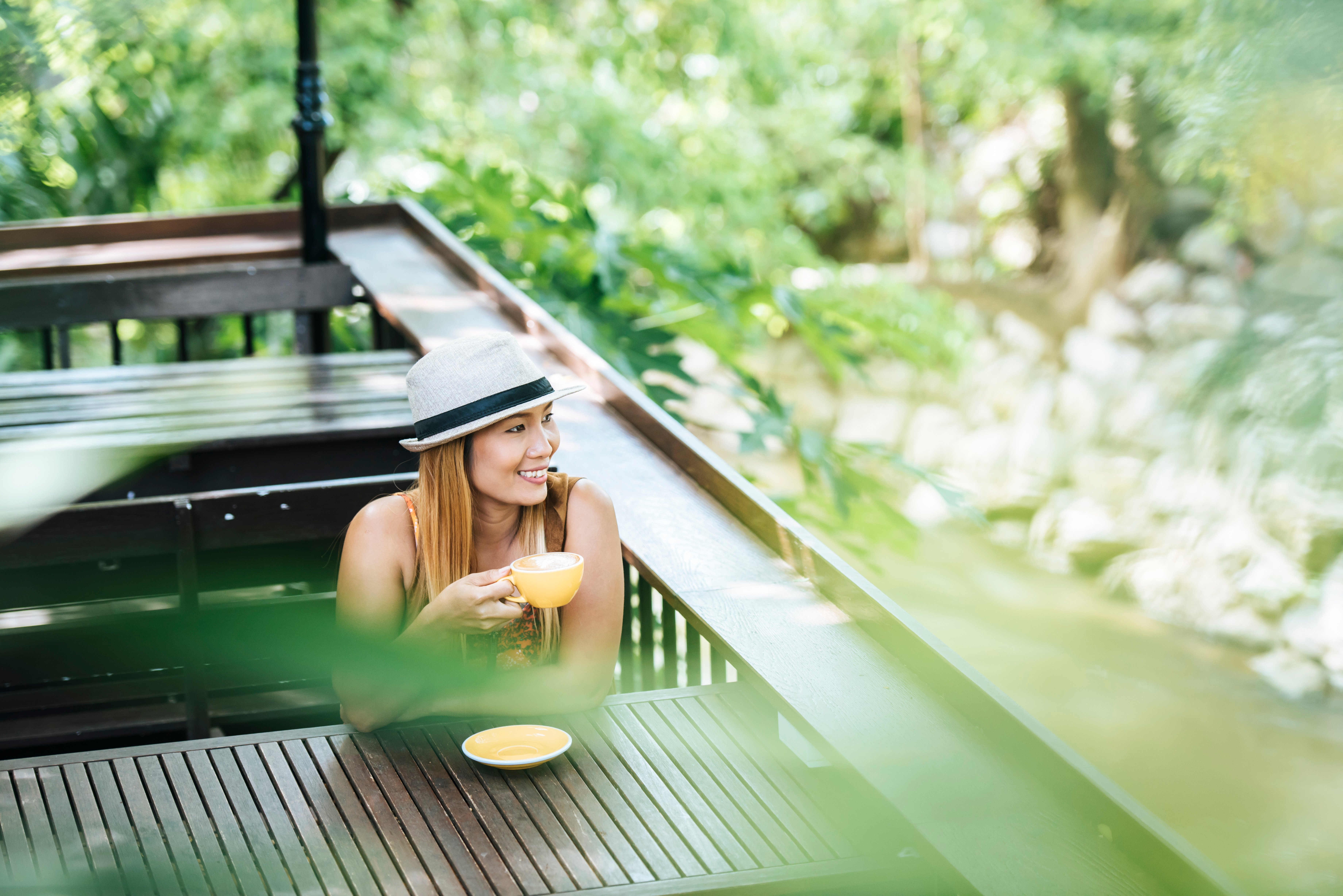 happy-young-woman-with-latte-coffee-morning