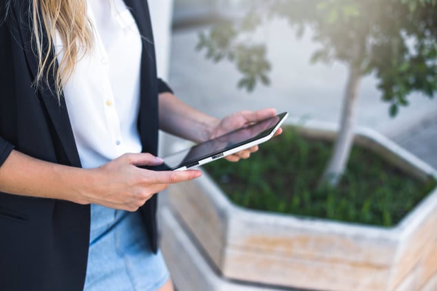 overhead-view-woman-holding-digital-tablet